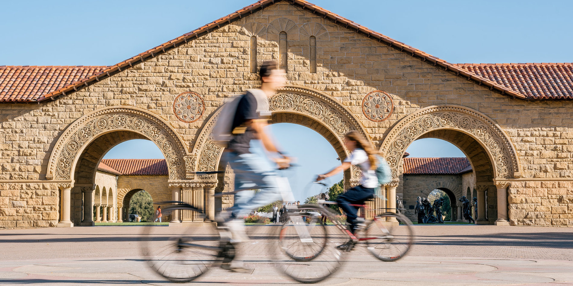 Students biking in Stanford Quad